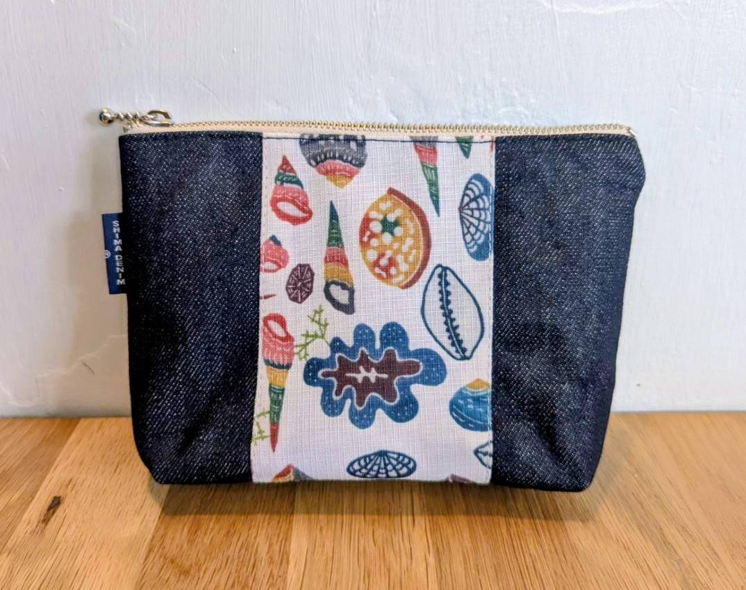 日本トランスオーシャン航空様の機内でオリジナルポーチ販売スタート